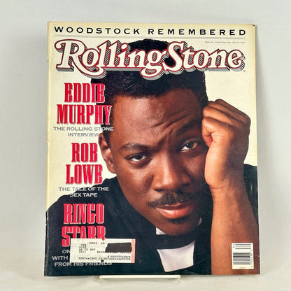 A vintage Rolling Stone magazine cover featuring Eddie Murphy in a black suit, with red and black text.