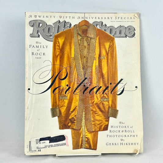 Vintage issue of Rolling Stone magazine with cover photo of Elvis' gold suit on white background. 