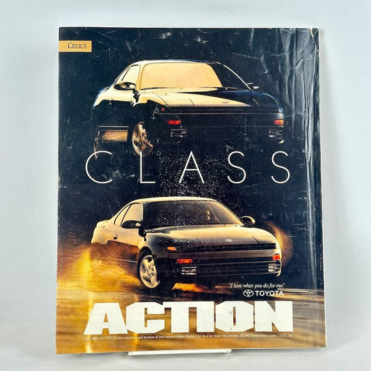 Back cover of magazine with full page ad for Toyota Celica featuring two 3/4 views of black vehicle. 