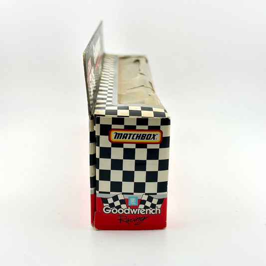 Matchbox packaging with checkered pattern and Goodwrench Racing branding on a white background