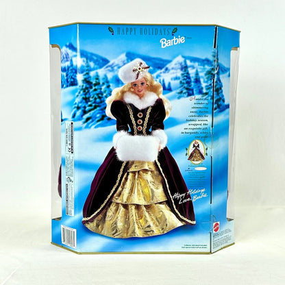 Barbie doll in holiday dress packaging with snowy landscape