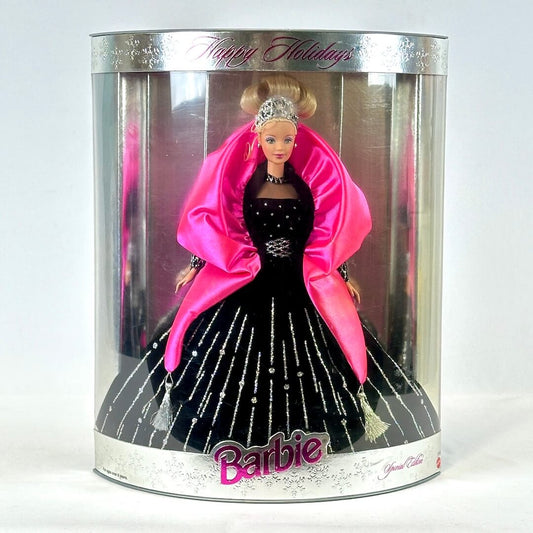 Barbie doll in a black dress with pink shawl in a 'Happy Holidays' packaging.