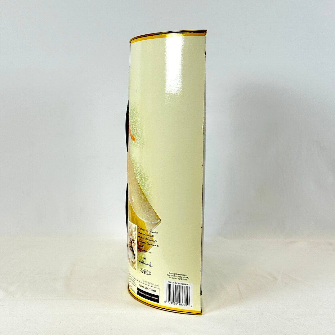 Side view of packaging for 2000 Celebration Barbie. 