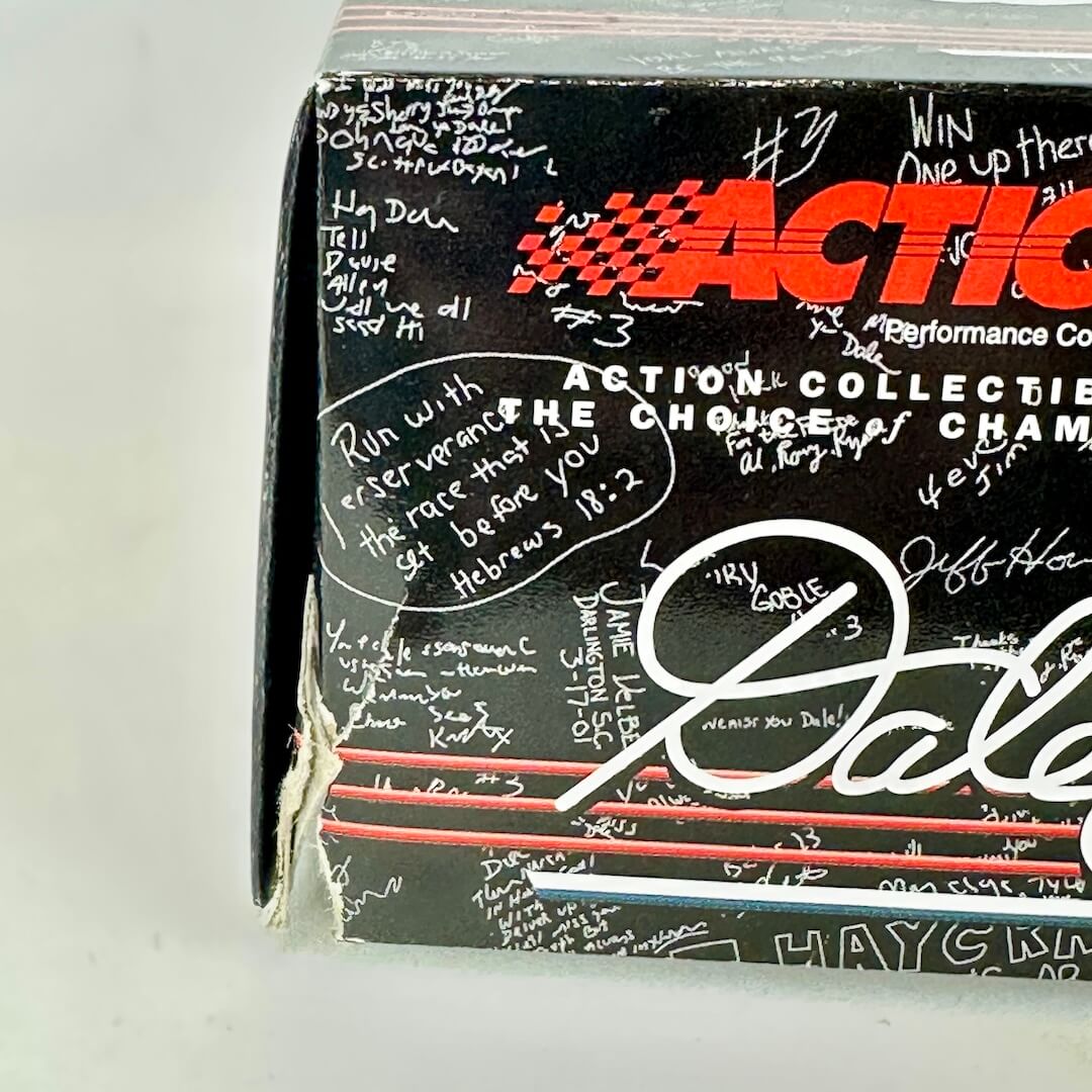 Action Collectibles packaging with signatures and branding on a white background