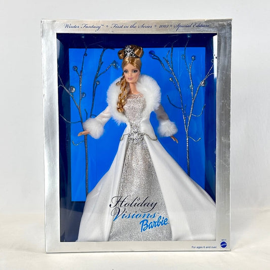Barbie doll in a winter-themed display case with a blue background