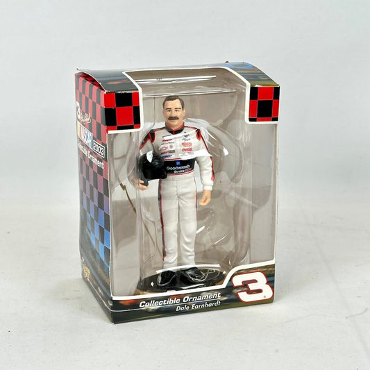 Collectible ornament of a race car driver in packaging with checkered pattern
