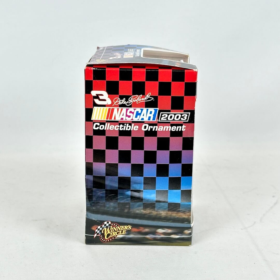 NASCAR collectible ornament packaging with checkered pattern and branding on a white background