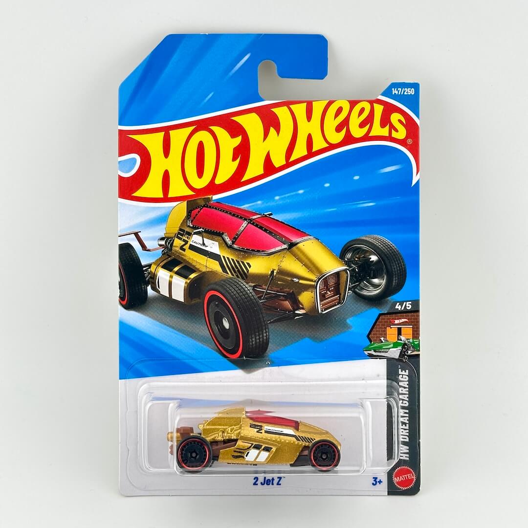 A Hot Wheels 'My Dream Garage' 2 Jet Z die-cast toy car in its original blister card packaging, featuring a gold and red car.
