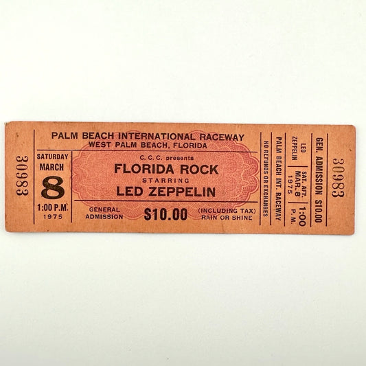 Orange rectangular concert ticket #30983 with black print for Florida Rock starring Led Zeppelin in Florida in 1975. 