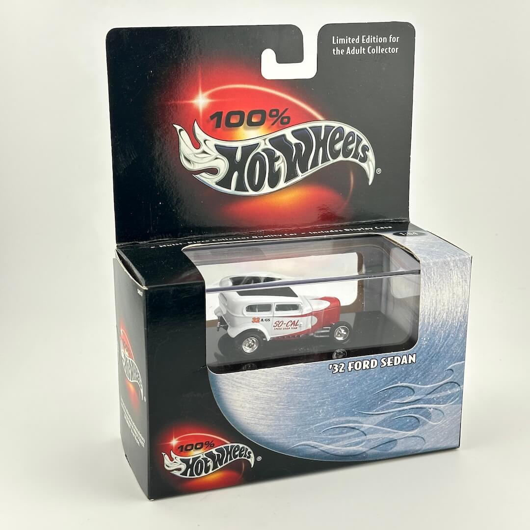 Hot Wheels collectible car in its original window packaging showing red and white 1932 Ford Sedan. 