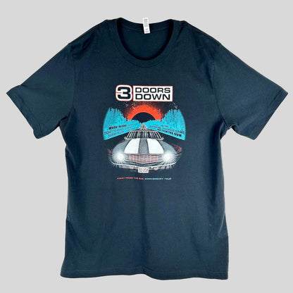 A black short-sleeve t-shirt with a graphic print on the front, featuring the text '3 DOORS DOWN' above an illustration.