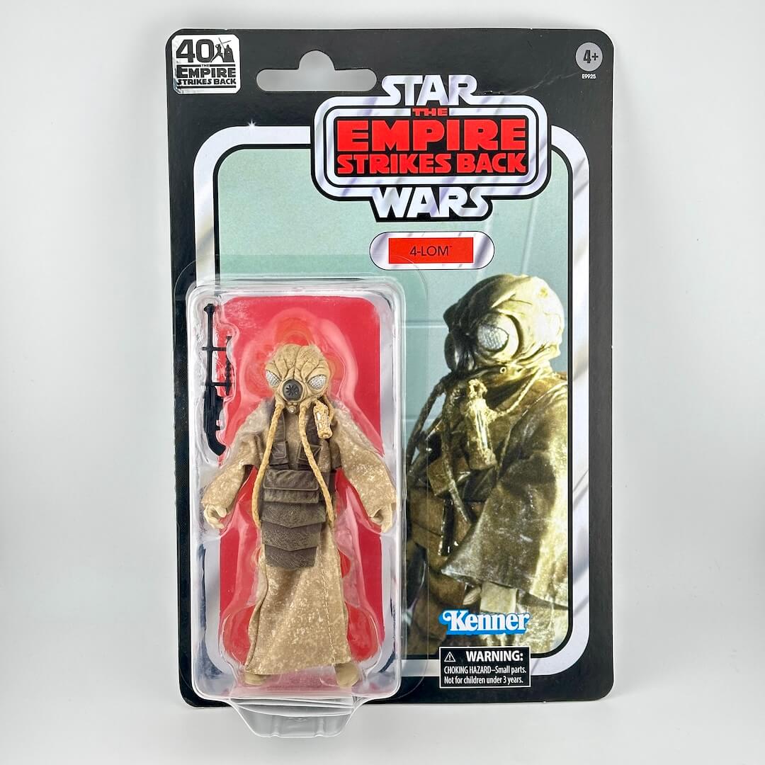 Star Wars action figure in original blister packaging with retro-style card back, figure in brown robe with accessory. 