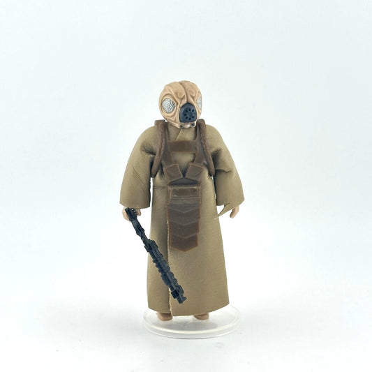 Action figure in a beige costume with a black gun on a white background