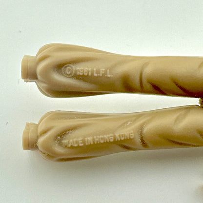 Close-up of back of legs of figure to show COO and copyright information. 
