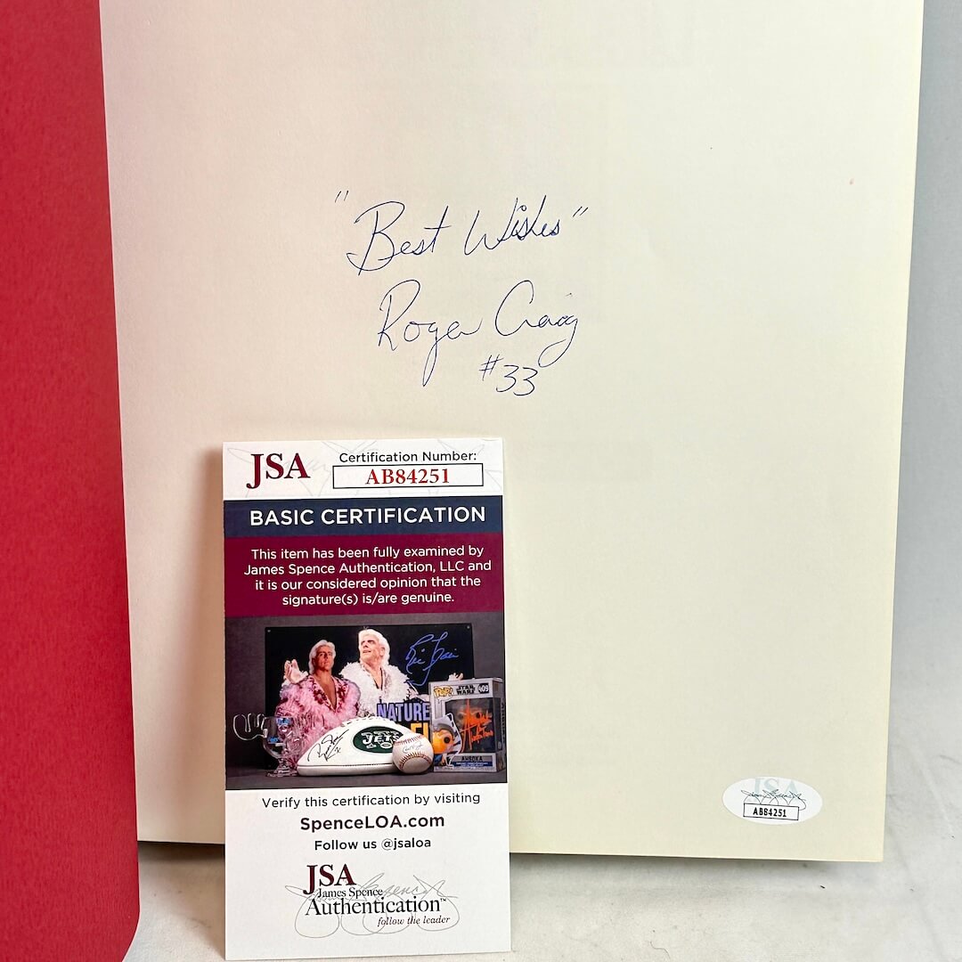 JSA certification card with a signature on a red and beige background