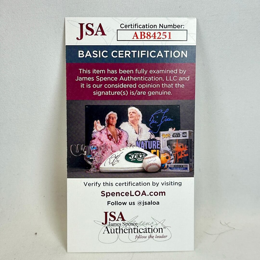 JSA certification card for a signature item on a gray background