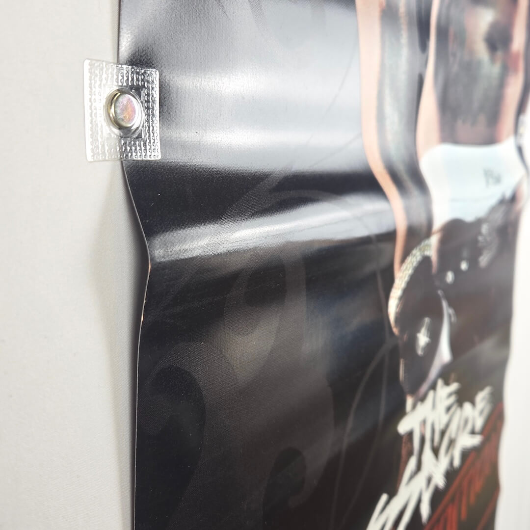 Close-up of a banner at an angle to show the bend in center of banner. 