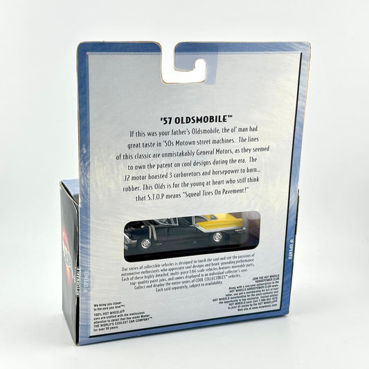 Back view of a packaged toy car set in its retail box, showing printed product information and a small window.