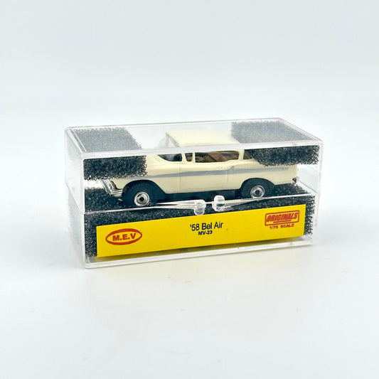 Model car in a clear display case with a white background
