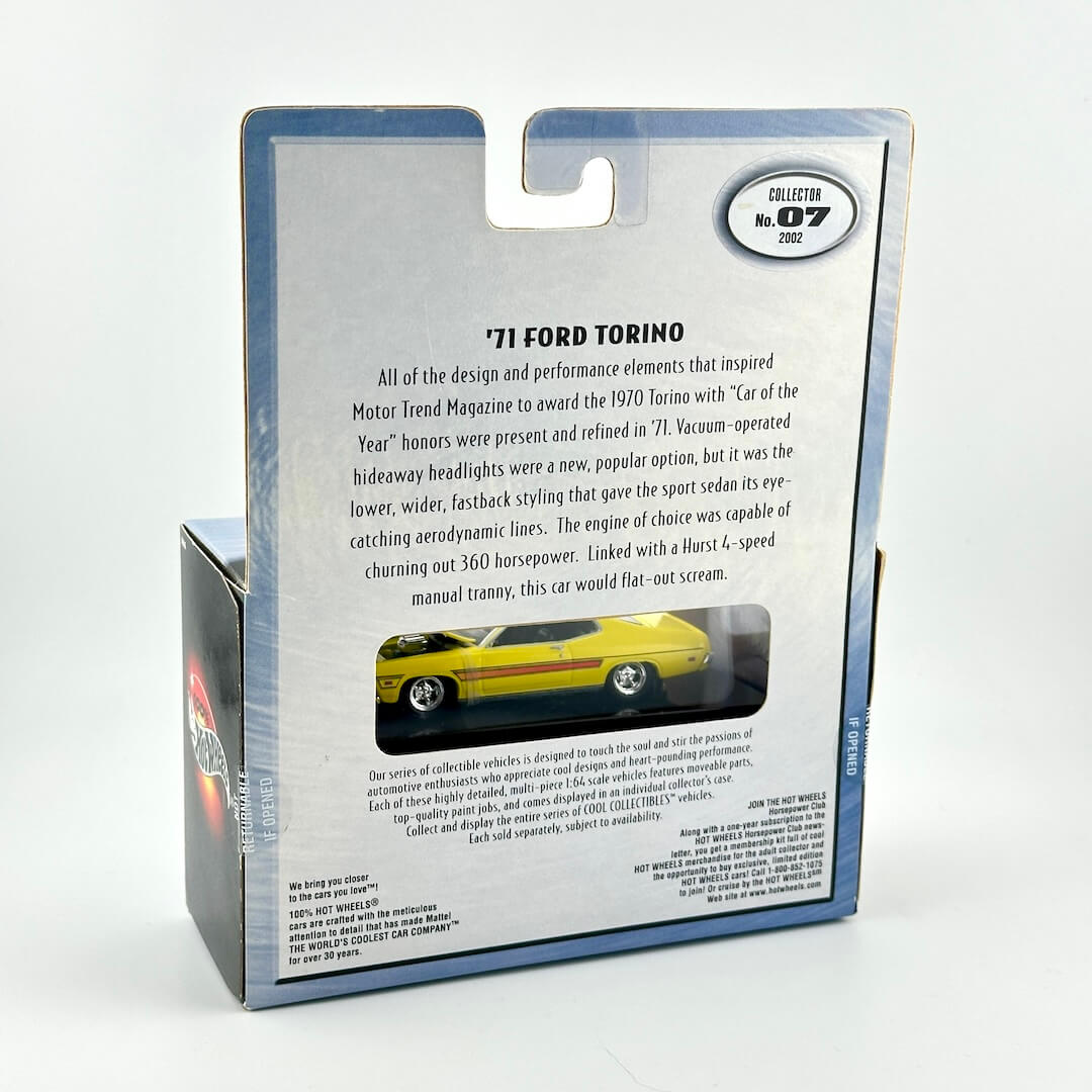 Back view of a packaged collectible model car in a silver and blue box, featuring printed text.