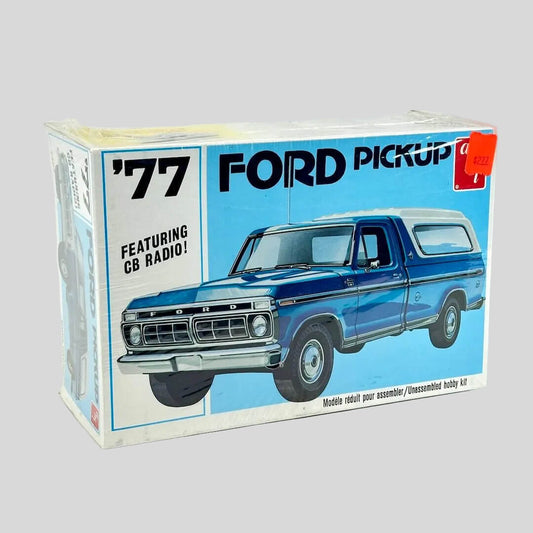 Model kit for '77 Ford Pickup still in plastic wrap against white background. 