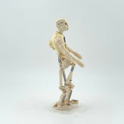 Toy figure of a robot on a white background, side view