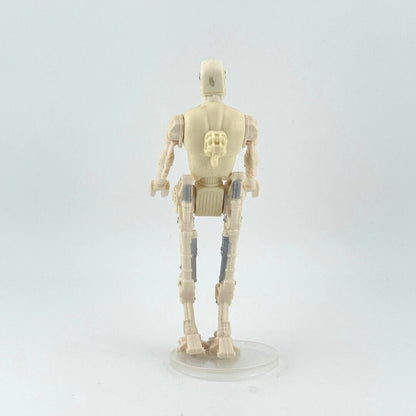 Toy figure of a robot on a white background, reverse view