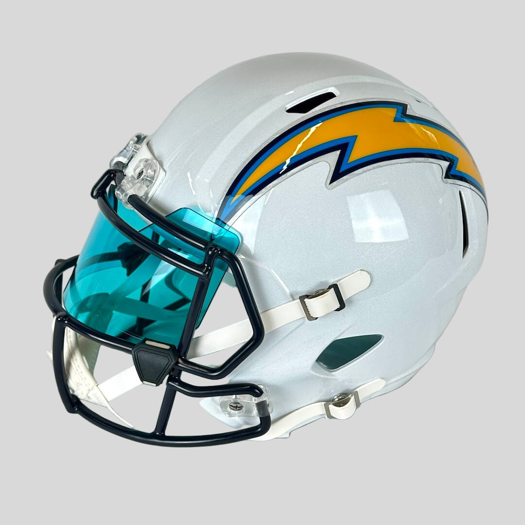 White football helmet with blue face mask and Chargers team logo on a light gray background