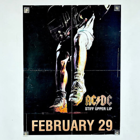 AC/DC 'Stiff Upper Lip' album cover with a boot and helmet on a dark background