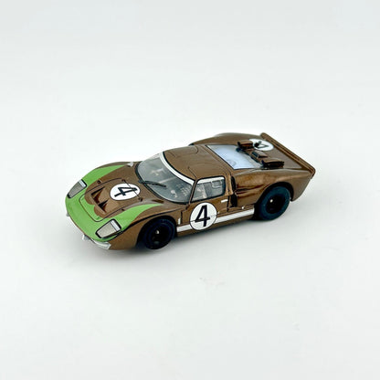 Model car with a green and brown design on a white background