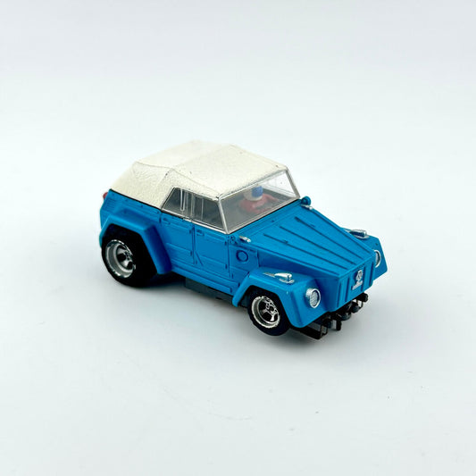 Blue toy car with a white roof on a light gray background