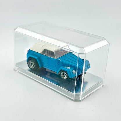 Blue model car in a clear display case on a white background