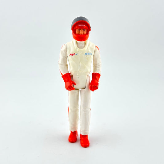 Action figure in a white suit with red accents on a light gray background