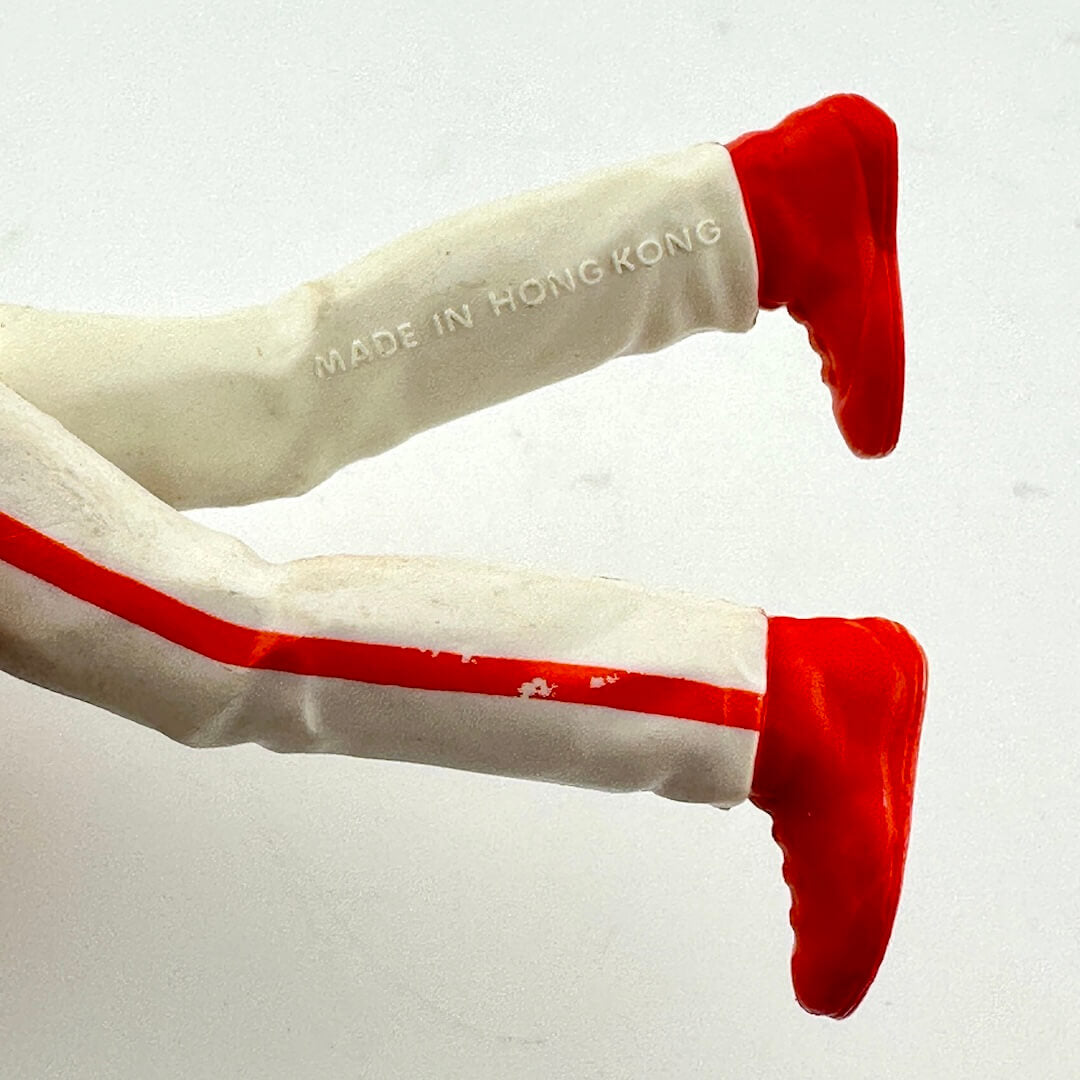 White pants with red stripes and red shoes on a white background, with 'Made in Hong Kong' text.