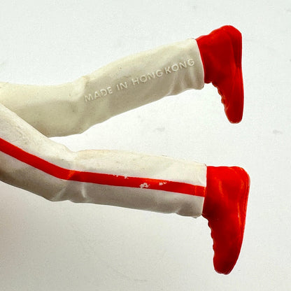 White pants with red stripes and red shoes on a white background, with 'Made in Hong Kong' text.