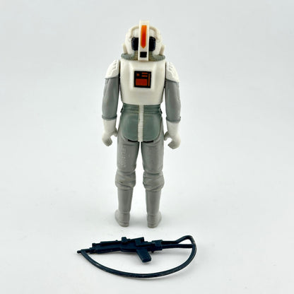 A vintage Star Wars action figure of a white and gray stormtrooper with black accessory.
