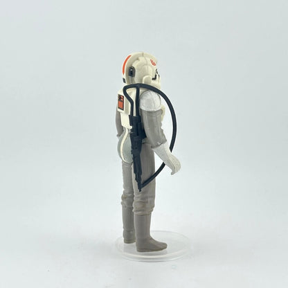 Toy figure of a character in a gray and white suit with helmet on a white background