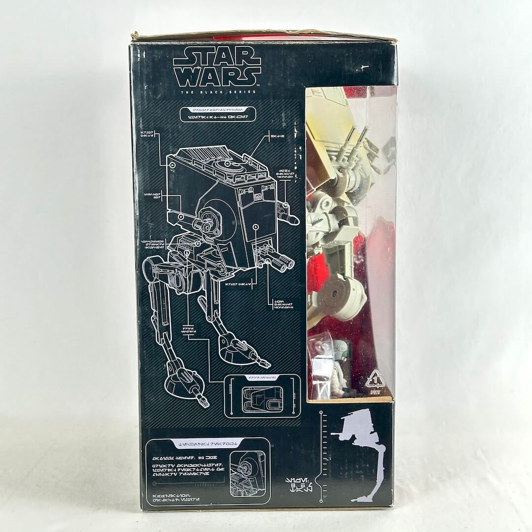 Star Wars AT-ST toy box, showing the black packaging with white technical schematics and a clear window.