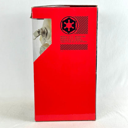A red Star Wars Imperial crest box with a clear window showing a small figure inside, photographed against a white background.