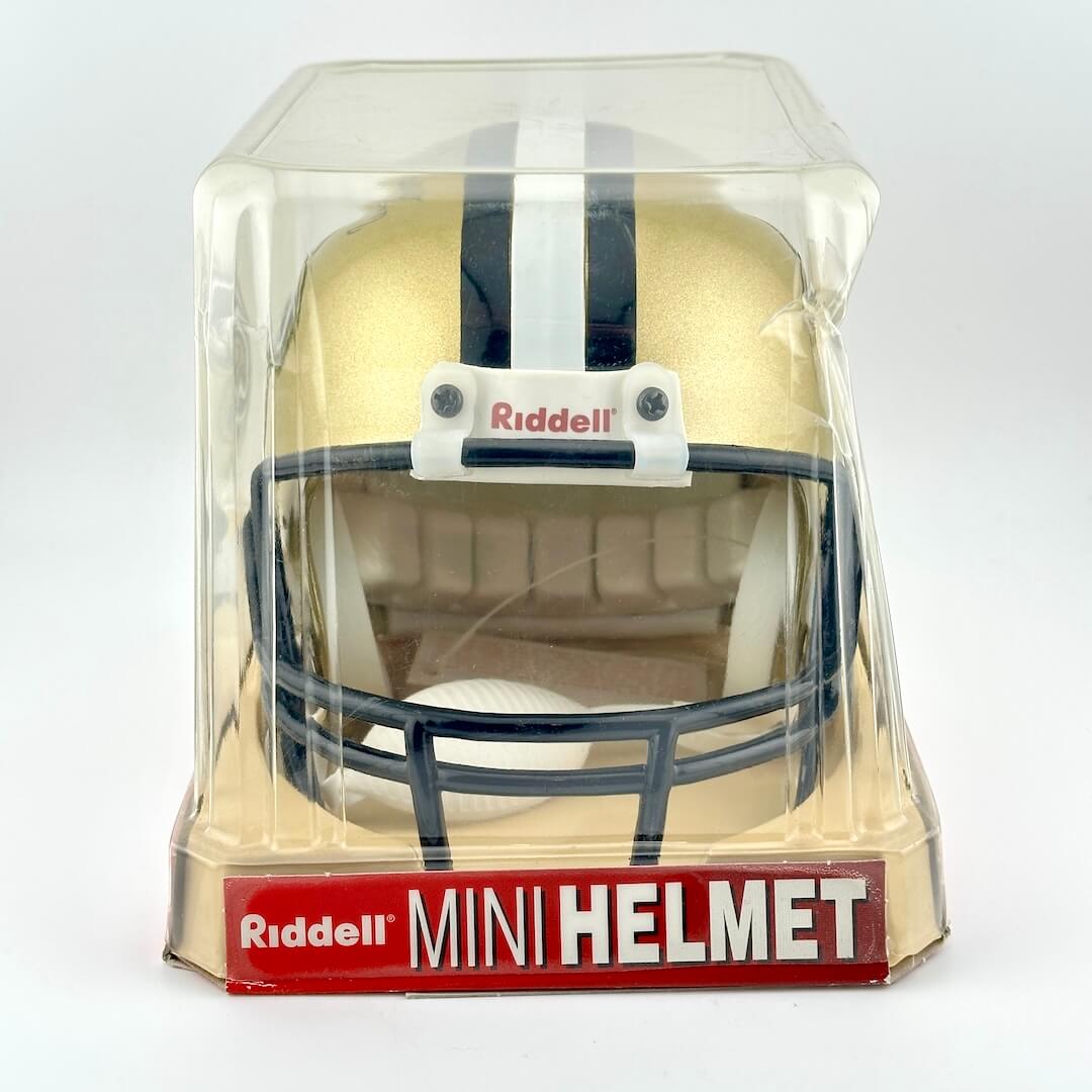 Riddell mini football helmet in clear packaging on a white background