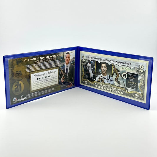 Collectible $2 bill with images of baseball players superimposed on currency next to certificate of authenticity. 