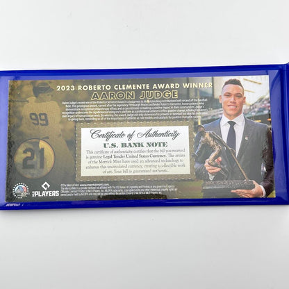 Certificate of Authenticity of bank note with image of Judge accepting award. 