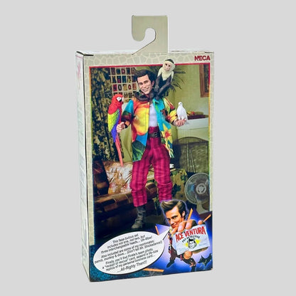 Boxed action figure of a character from 'Ace Ventura' with parrots, on a white background