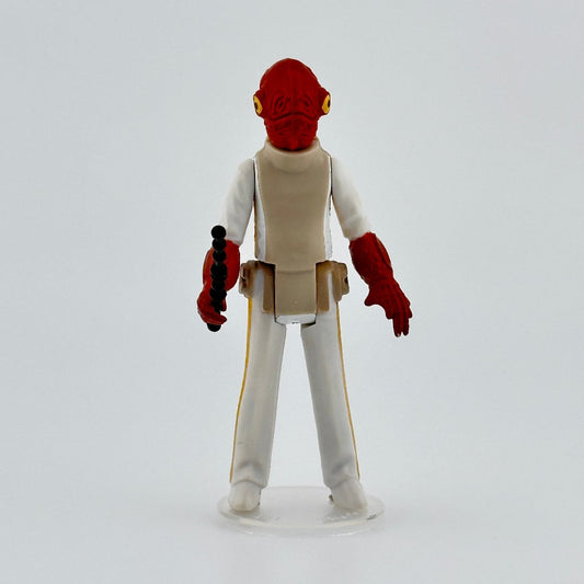 Image of 3.5 inch alien action figure with red skin, yellow eyes on either side of head, white clothes, & black gun