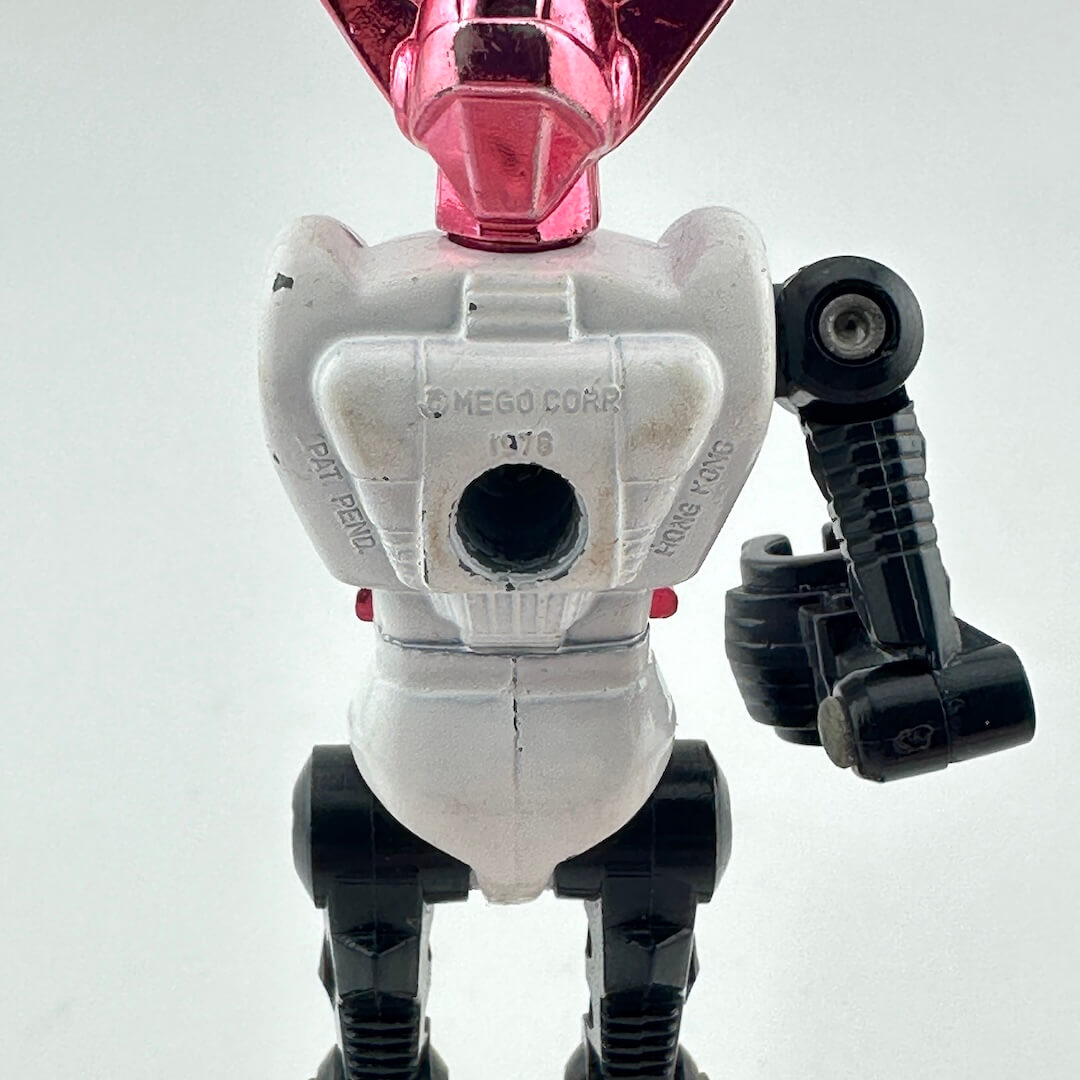 Close-up of back of action figure to show COO and copyright information embossed into back. 
