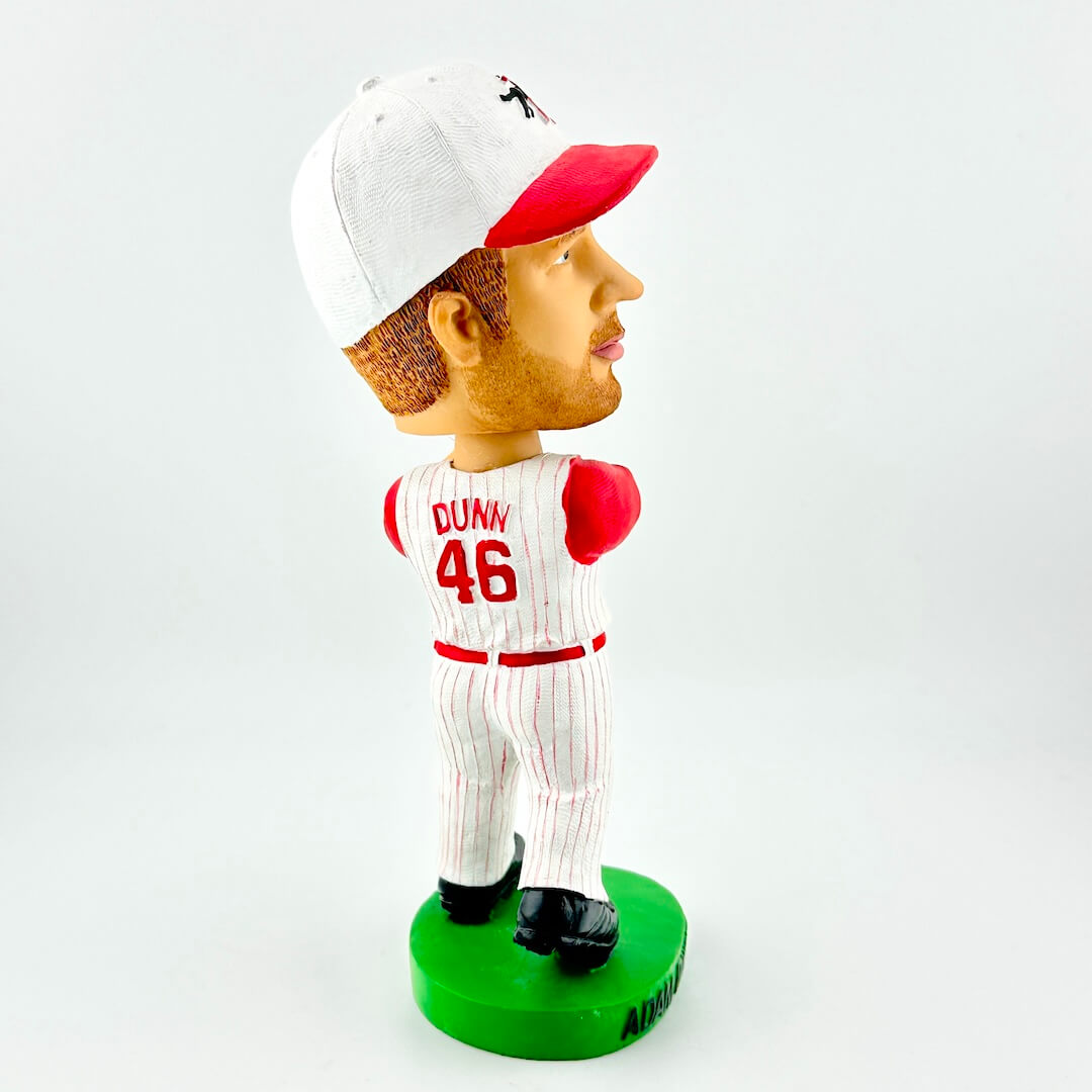 Bobblehead figure of a baseball player holding a bat on a white background