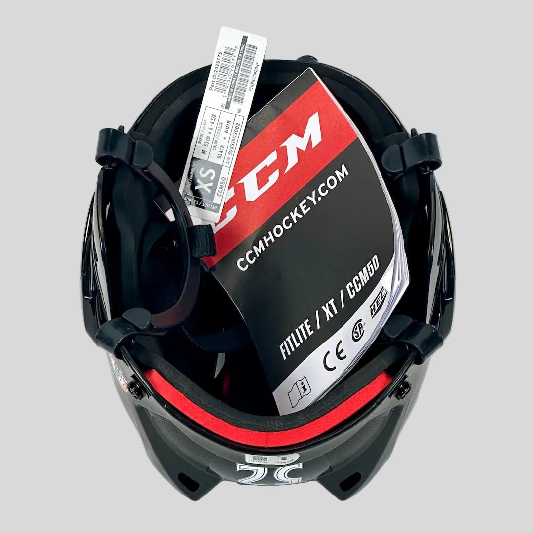 Black hockey helmet with CCM branding on a white background