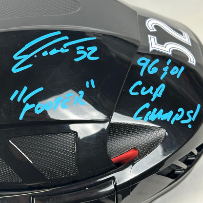 Close-up of helmet with hand-written text in blue marker.