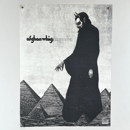 Album cover with a figure in a dark robe and pyramids, featuring the text 'afghan whigs' and 'in spades'.