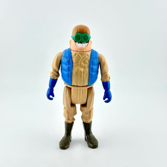 Action figure with a blue vest and green goggles on a white background
